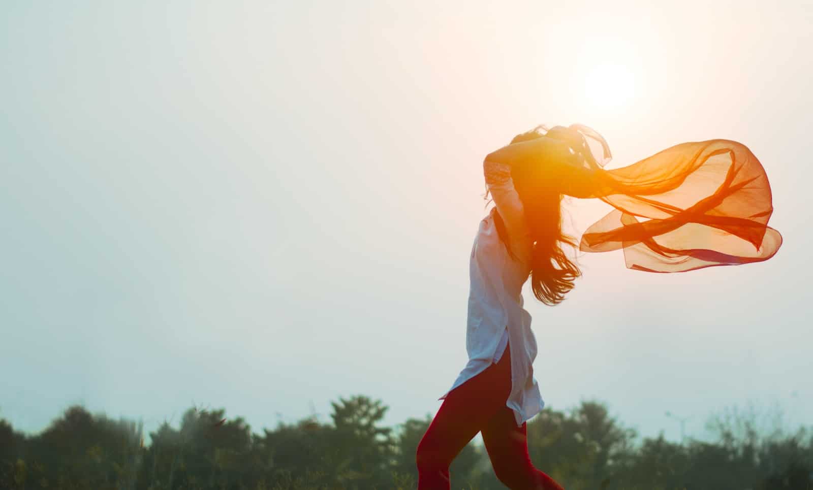 woman spreading hair at during sunset